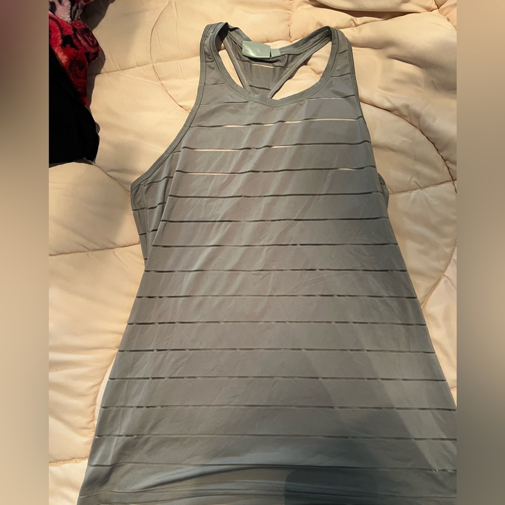 Athleta Women’s sheer Razorback tank. Grey medium. Small spot on front shown